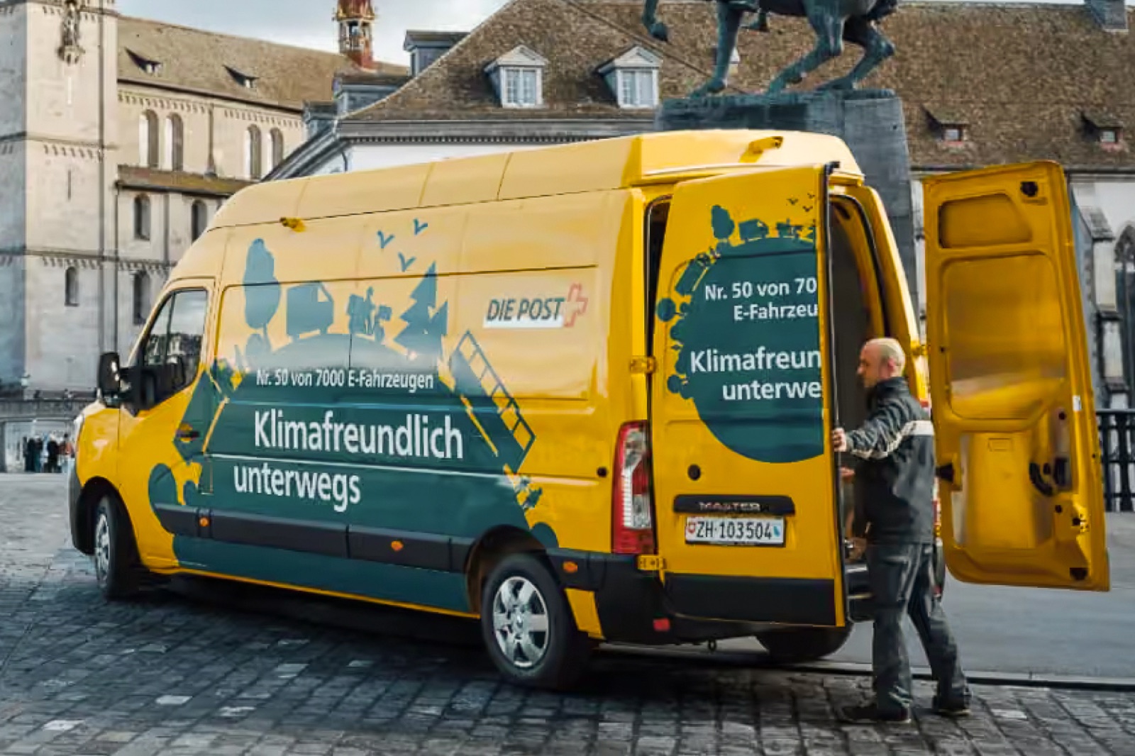 Swiss Post delivery van traveling through the city